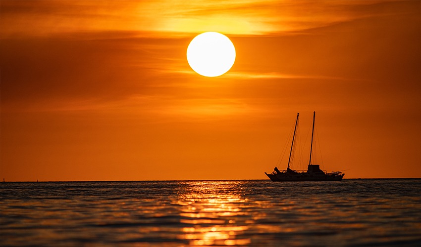 Darwin sunset cruise experience featuring glowing ocean views and a dramatic tropical sunset