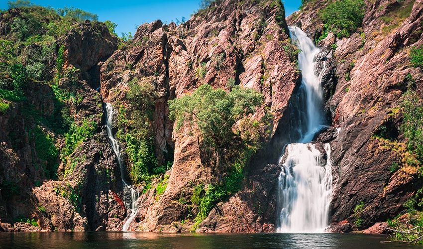 Waterfall cascading through rugged cliffs at Litchfield National Park in the Northern Territory