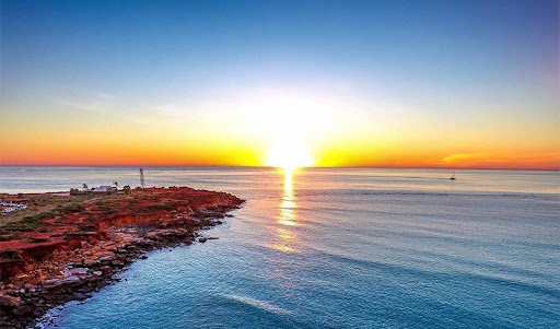 Sun setting over the Indian Ocean at Broome with colourful coastal scenery